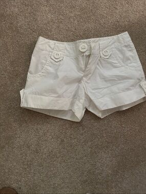 White Cuffed Cotton Bermuda Shorts with decorative style buttons 4 pockets.